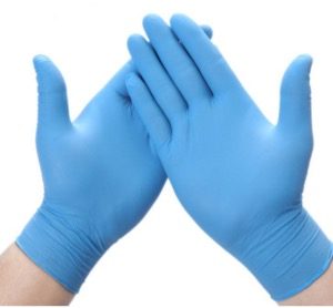 man displays powder free nitrile gloves supplied by Everprogroup